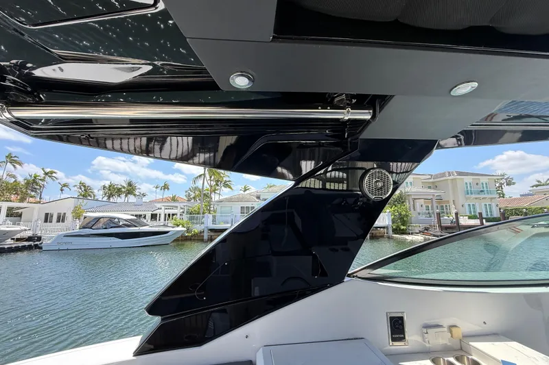 Slide: The Image of 2021 Cruisers Yachts 38 GLS OB interior with waterfront view and modern design elements. - 20