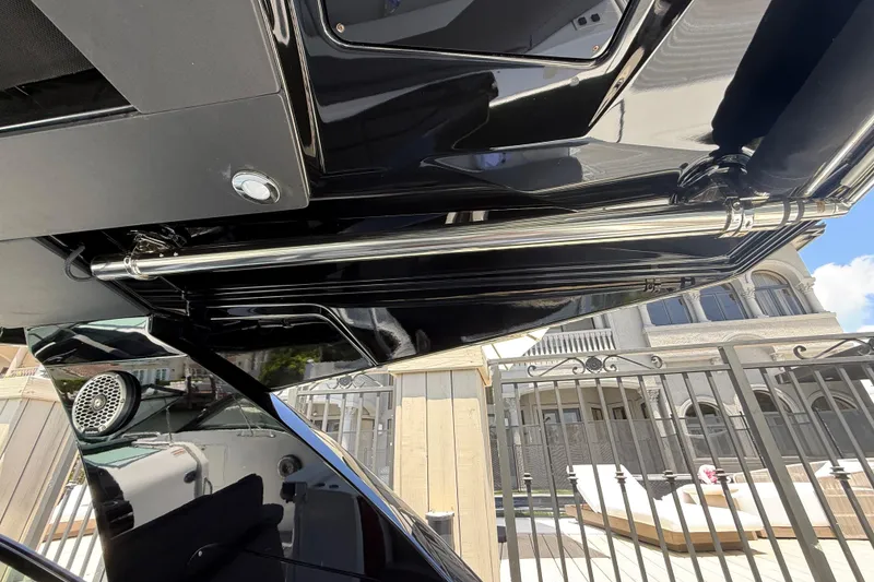 Slide: The Image of 2021 Cruisers Yachts 38 GLS OB, sleek black exterior with stainless steel accents. - 22