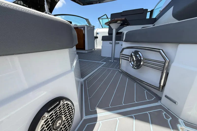 Slide: The Image of 2021 Cruisers Yachts 38 GLS OB interior with sleek seating and modern design elements. - 28
