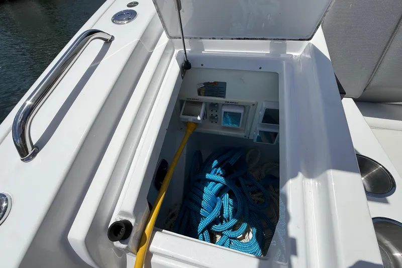 Slide: The Image of Storage compartment on 2021 Cruisers Yachts 38 GLS OB with ropes and equipment. - 29