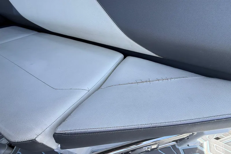 Slide: The Image of 2021 Cruisers Yachts 38 GLS OB seat with visible stitching and wear. - 36