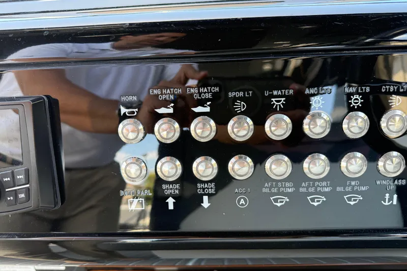 Slide: The Image of Control panel of a 2021 Cruisers Yachts 38 GLS OB with various labeled buttons. - 42