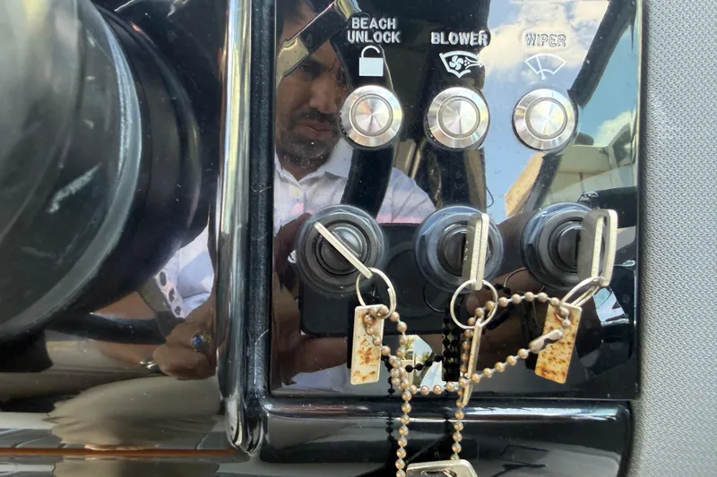 Slide: The Image of Control panel of a 2021 Cruisers Yachts 38 GLS OB with keys and switches. - 43