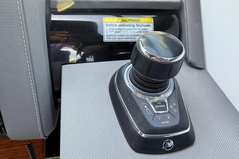 Slide: The Image of Joystick control panel on 2021 Cruisers Yachts 38 GLS OB boat with Skyhook feature. - 44
