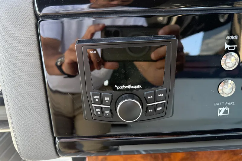 Slide: The Image of Control panel of a 2021 Cruisers Yachts 38 GLS OB with Rockford Fosgate audio system. - 49