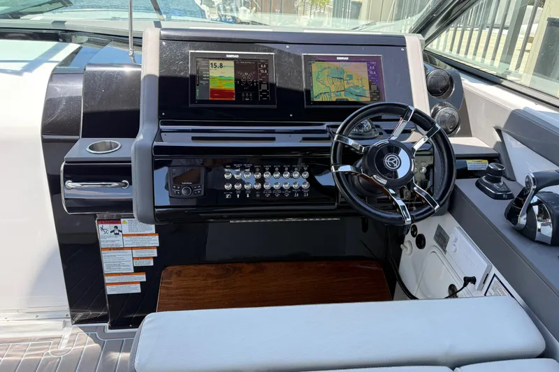 Slide: The Image of Cockpit of 2021 Cruisers Yachts 38 GLS OB with modern navigation displays and controls. - 50