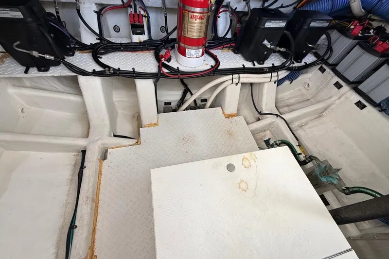 Slide: The Image of Engine compartment of 2021 Cruisers Yachts 38 GLS OB with wiring and fire extinguisher. - 66