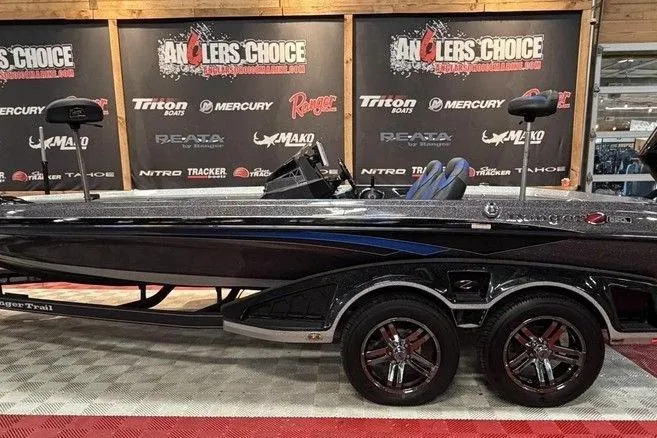 The Image of 2019 Ranger Z520L bass boat displayed at Anglers Choice event with branded backdrop. - 1