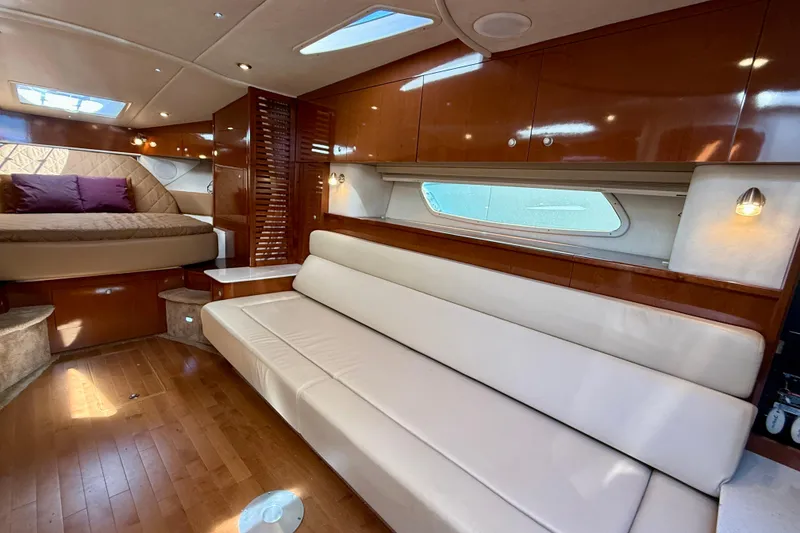 Slide: The Image of Luxurious interior of 2009 Sea Ray Sundancer 350 yacht with elegant seating and wood finishes. - 7