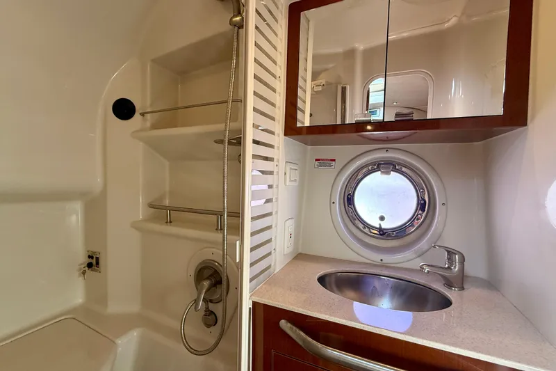 Slide: The Image of Bathroom interior of 2009 Sea Ray Sundancer 350 yacht with sink and porthole. - 9