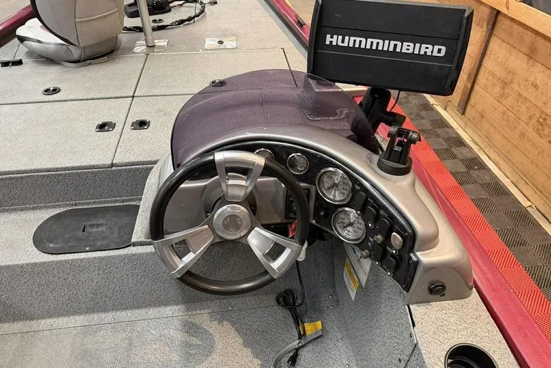 Slide: The Image of 2015 G3 Eagle 176 boat dashboard with steering wheel and Humminbird fish finder. - 6