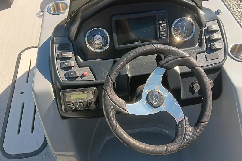 Slide: The Image of 2023 Veranda Relax VR22RC helm with steering wheel and gauges. - 7