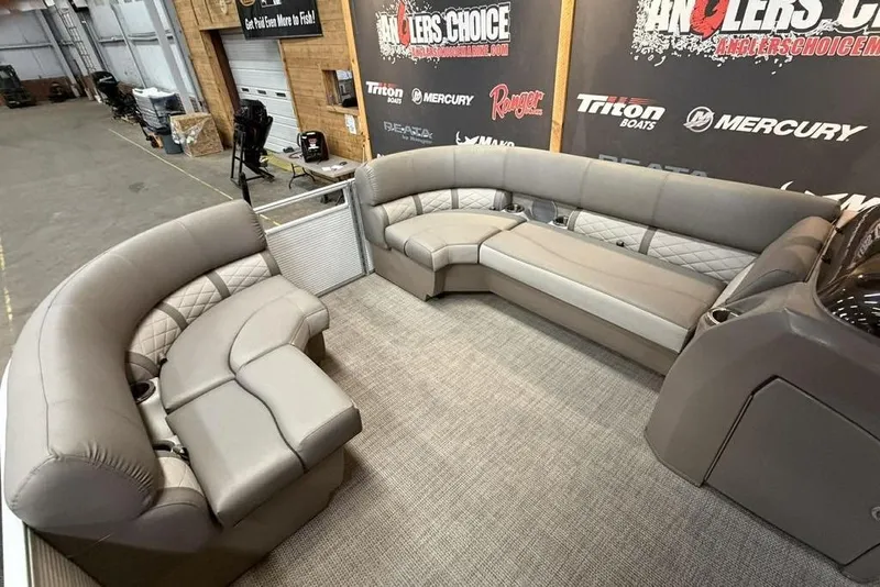 Slide: The Image of Luxurious seating on a 2019 Bennington 22 SSBXP pontoon boat, displayed indoors. - 11