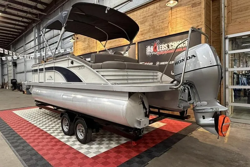 Slide: The Image of 2019 Bennington 22 SSBXP pontoon boat with Honda outboard motor in showroom. - 3
