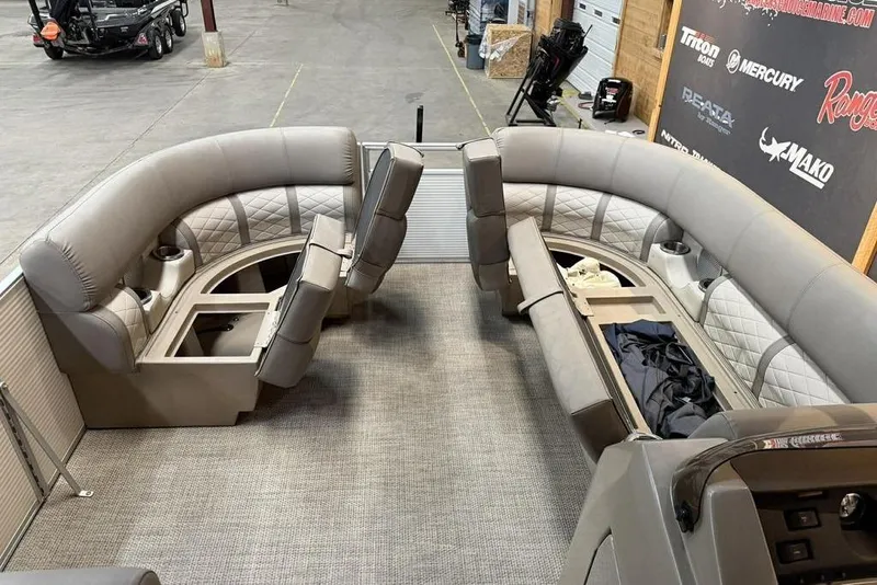 Slide: The Image of 2019 Bennington 22 SSBXP pontoon boat interior with plush seating and storage compartments. - 8