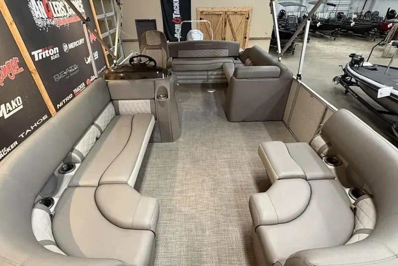 Slide: The Image of 2019 Bennington 22 SSBXP pontoon boat interior with luxurious seating and helm. - 9