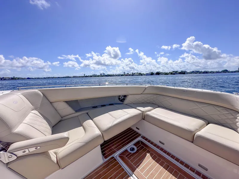Slide: The Image of Luxurious seating on 2019 Regal 33 OBX boat with scenic ocean view. - 23