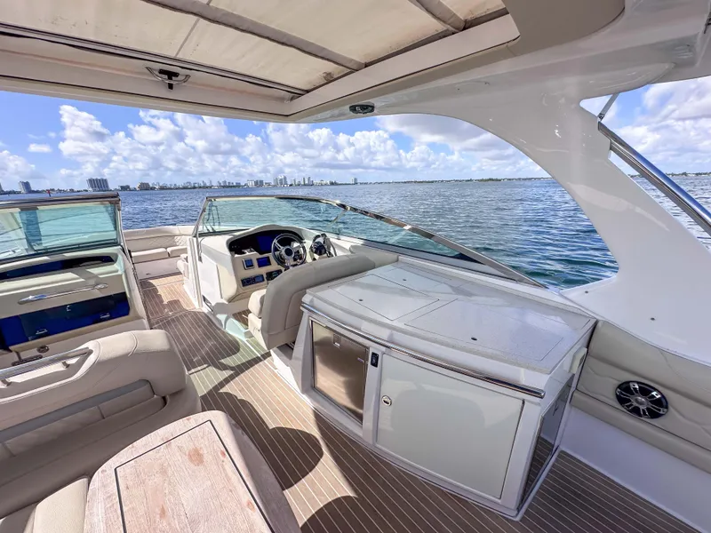 Slide: The Image of 2019 Regal 33 OBX boat interior with luxurious seating and ocean view. - 30