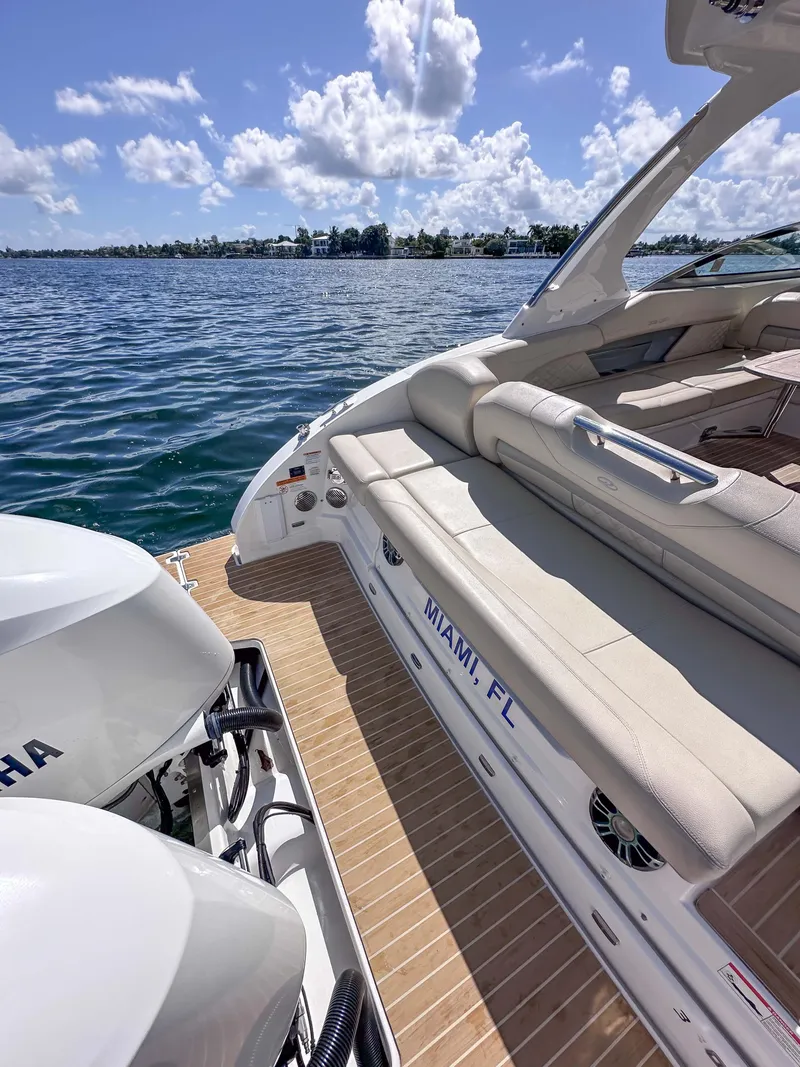 Slide: The Image of 2019 Regal 33 OBX boat with Yamaha engines, docked in Miami, FL, on a sunny day. - 31