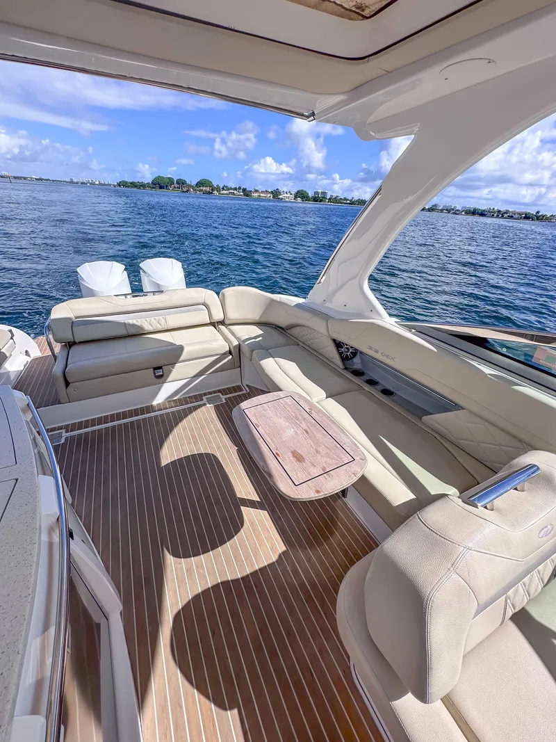 Slide: The Image of 2019 Regal 33 OBX yacht interior with luxurious seating and ocean view. - 37