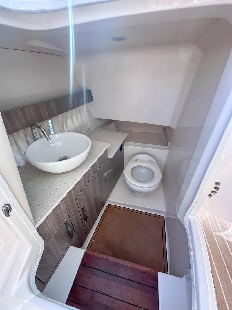 Slide: The Image of 2019 Regal 33 OBX boat bathroom with modern sink and toilet. - 43