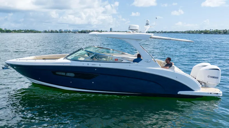 Slide: The Image of 2019 Regal 33 OBX boat cruising on a sunny day. - 9