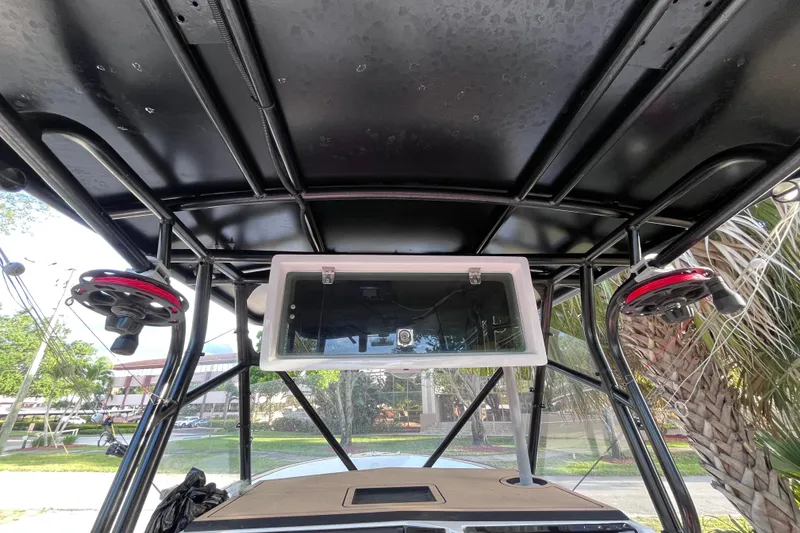 Slide: The Image of T-top view of a 1993 Cape Horn 27 boat with mounted speakers and storage. - 8