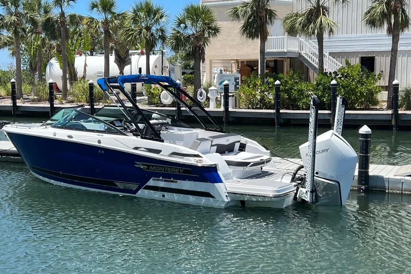 The Image of 2023 Monterey 255SS Super Sport boat docked near palm trees. - 0