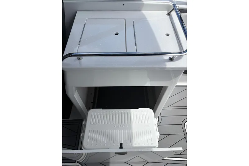 Slide: The Image of 2023 Monterey 255SS Super Sport boat cooler storage compartment. - 12