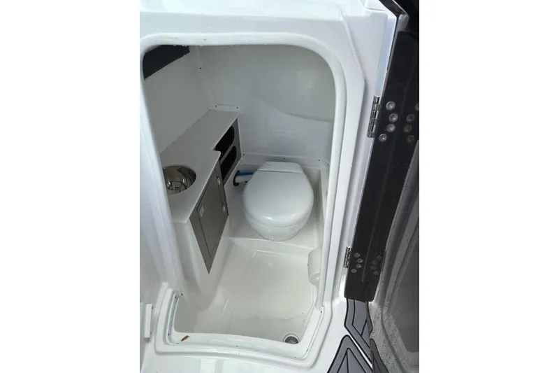 Slide: The Image of 2023 Monterey 255SS Super Sport boat bathroom with toilet and sink. - 5