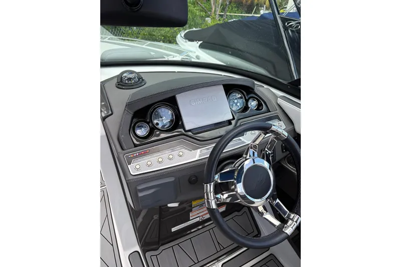 Slide: The Image of 2023 Monterey 255SS Super Sport dashboard with steering wheel and control panel. - 6