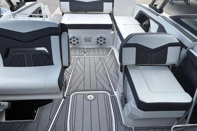 Slide: The Image of 2023 Monterey 255SS Super Sport boat interior with stylish seating and modern flooring. - 9