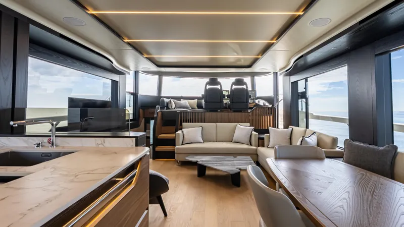 Slide: The Image of Luxurious interior of 2025 Absolute Navetta 64 yacht with modern furnishings and panoramic windows. - 19