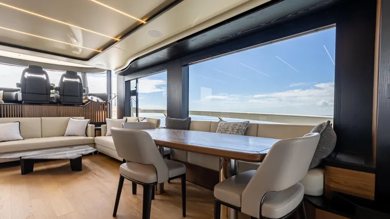 Slide: The Image of Luxurious interior of 2025 Absolute Navetta 64 yacht with elegant seating and ocean view. - 21