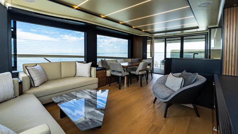 Slide: The Image of Luxurious interior of 2025 Absolute Navetta 64 yacht with modern furnishings and panoramic windows. - 26