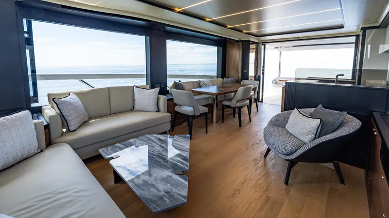 Slide: The Image of Luxurious interior of 2025 Absolute Navetta 64 yacht with modern furnishings and ocean view. - 27