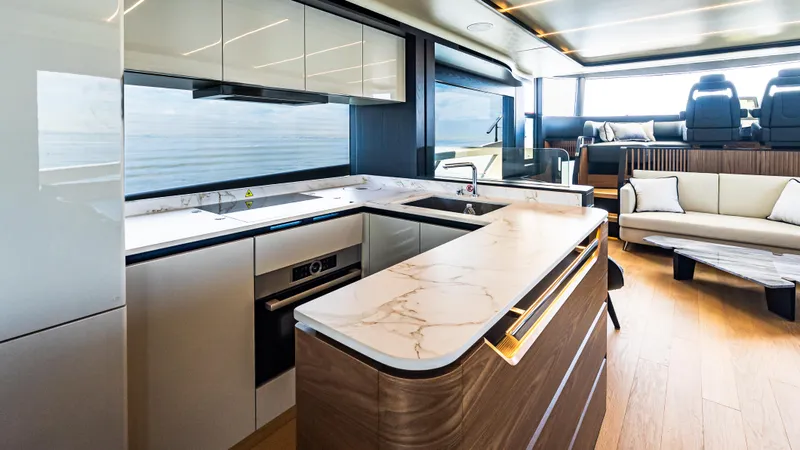 Slide: The Image of Luxurious kitchen interior of 2025 Absolute Navetta 64 yacht with modern design and elegant finishes. - 28