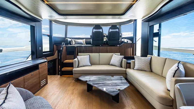 Slide: The Image of Luxurious interior of 2025 Absolute Navetta 64 yacht with modern furnishings and panoramic windows. - 29