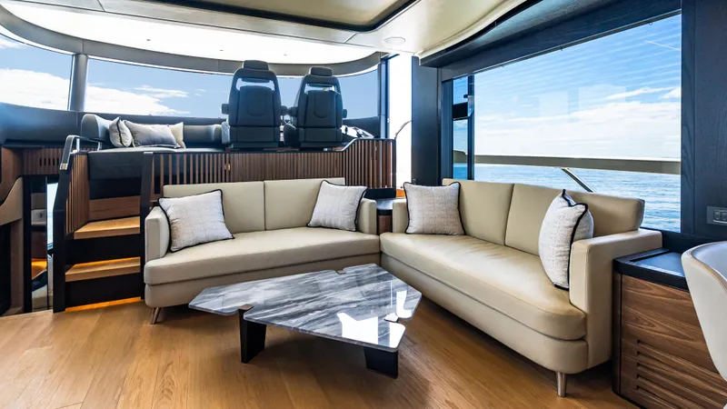 Slide: The Image of Luxurious interior of 2025 Absolute Navetta 64 yacht with elegant seating and ocean view. - 30