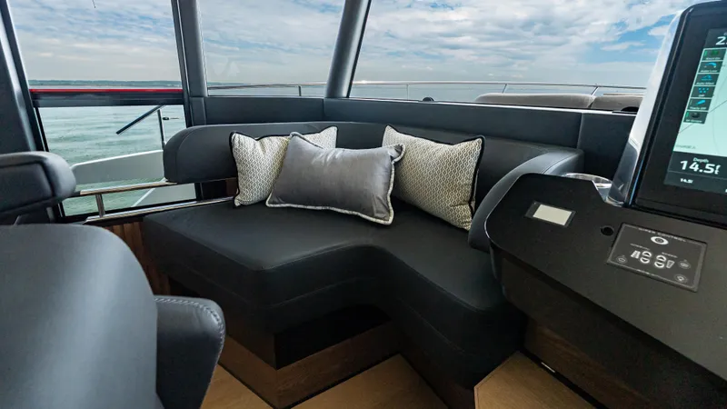 Slide: The Image of Luxurious interior of 2025 Absolute Navetta 64 yacht with plush seating and cushions. - 32