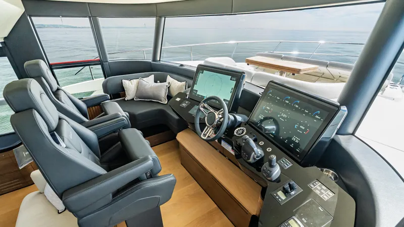 Slide: The Image of Luxurious helm of 2025 Absolute Navetta 64 yacht with advanced navigation systems. - 33