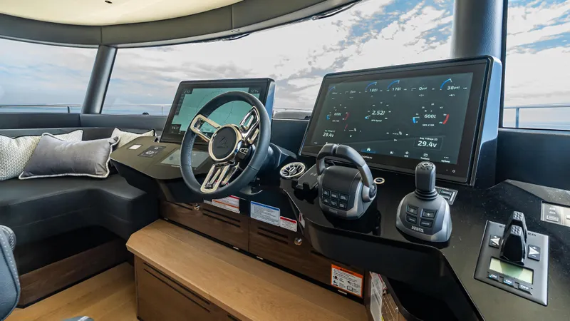 Slide: The Image of Helm of 2025 Absolute Navetta 64 yacht with advanced navigation systems. - 34
