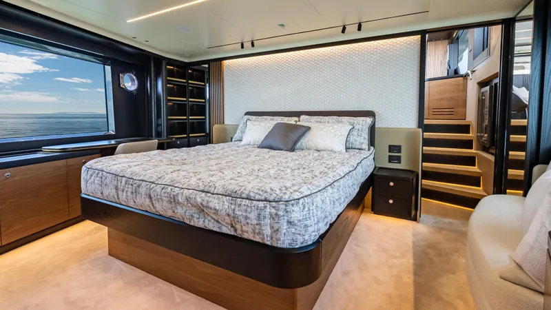 Slide: The Image of Luxurious bedroom in 2025 Absolute Navetta 64 yacht with modern design and ocean view. - 37
