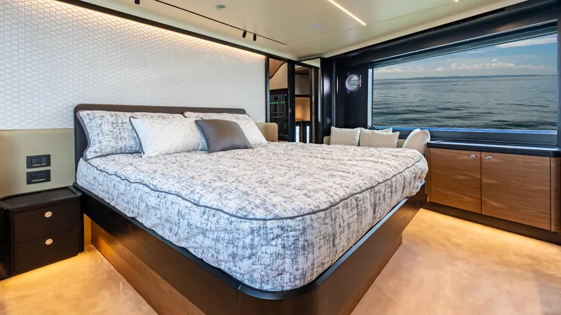 Slide: The Image of Luxurious bedroom interior of 2025 Absolute Navetta 64 yacht with ocean view. - 41