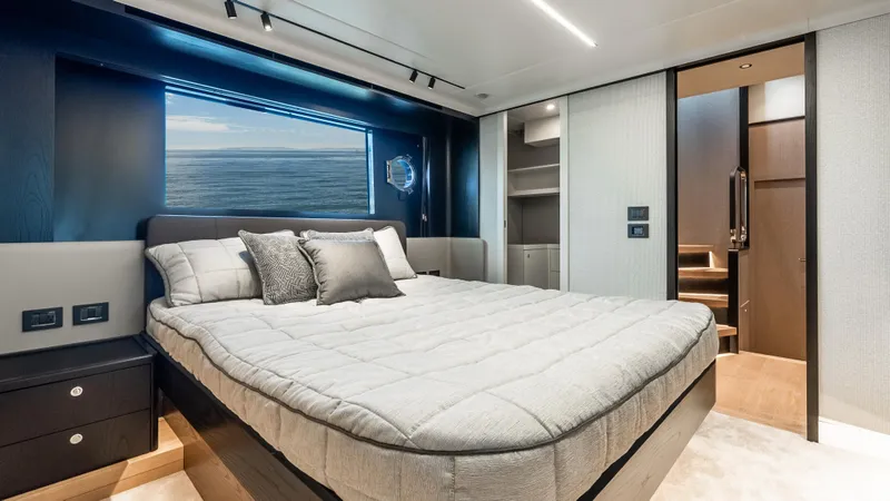 Slide: The Image of Luxurious bedroom interior of 2025 Absolute Navetta 64 yacht with ocean view. - 46
