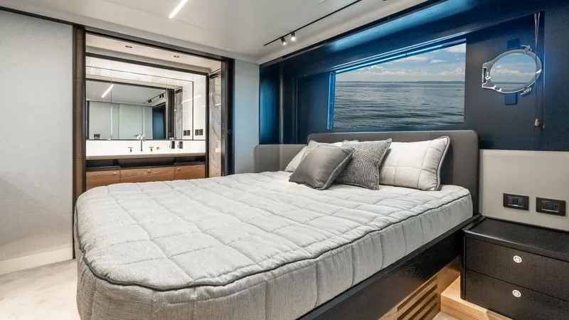 Slide: The Image of Luxurious bedroom interior of 2025 Absolute Navetta 64 yacht with ocean view. - 47