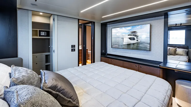 Slide: The Image of Luxurious bedroom interior of 2025 Absolute Navetta 64 yacht with modern decor and large bed. - 49