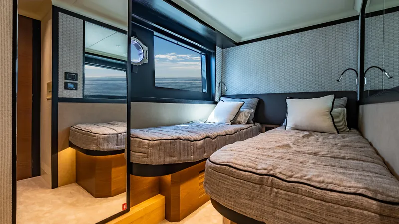 Slide: The Image of Twin cabin interior of 2025 Absolute Navetta 64 yacht with ocean view. - 50