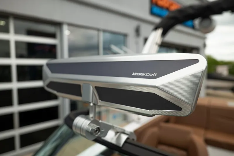 Slide: The Image of 2026 MasterCraft NXT23 boat mirror, sleek design, close-up view. - 26