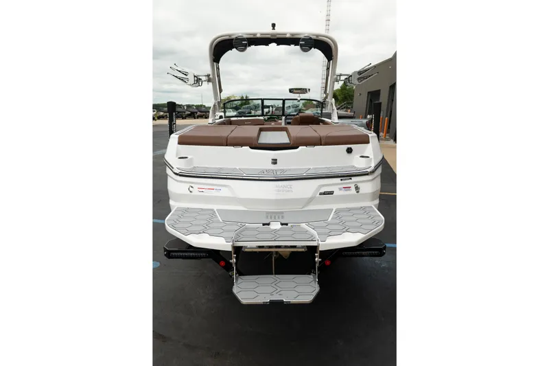 Slide: The Image of 2026 MasterCraft NXT23 boat, rear view, showcasing swim platform and sleek design. - 6